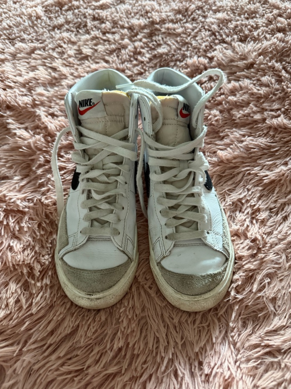Nike White High-Top Sneakers with Black Swoosh and Red Logo